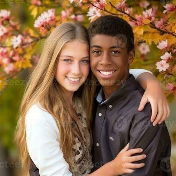 Young interracial couple in love on Valentine's day posing while